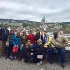 Study abroad students, faculty, and staff with Zurich in the background.